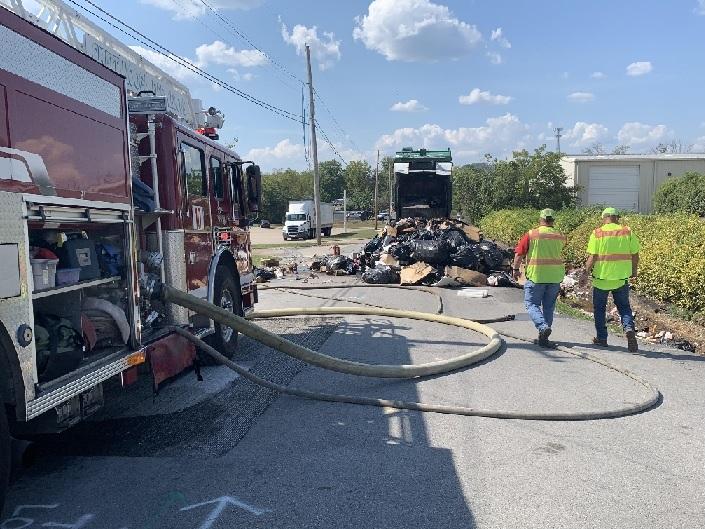 Ambulance crews step up to help driving of burning trash truck