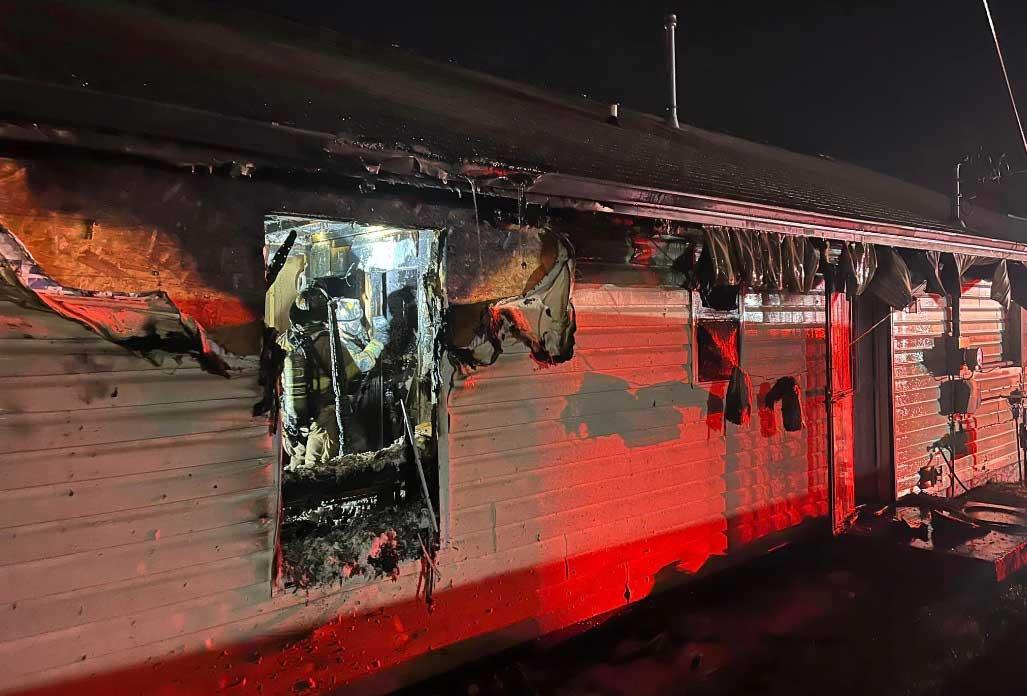 East 3rd St fire damages rear of home