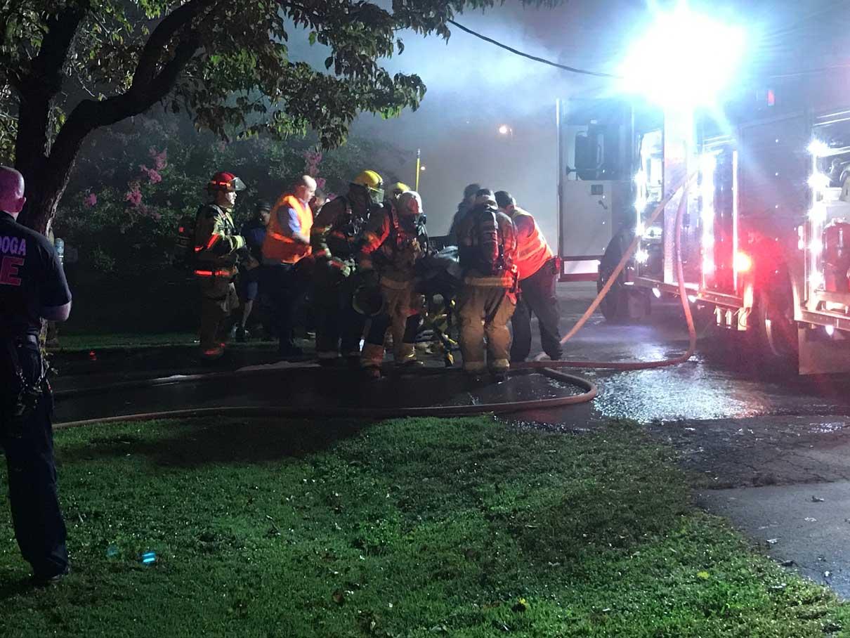 Firefighters Pull Woman from Burning Home