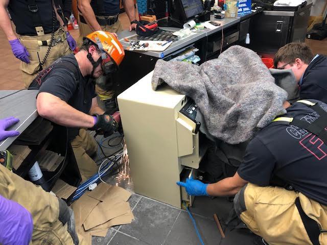 Firefighters successfully free woman’s hand from safe inside convenience store