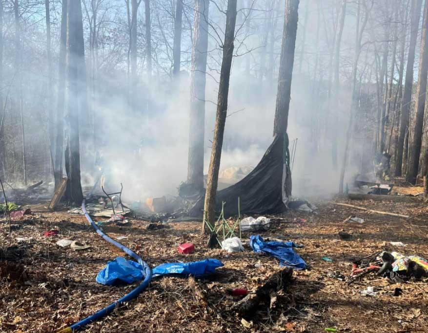 Homeless camp fire near 75/24 split