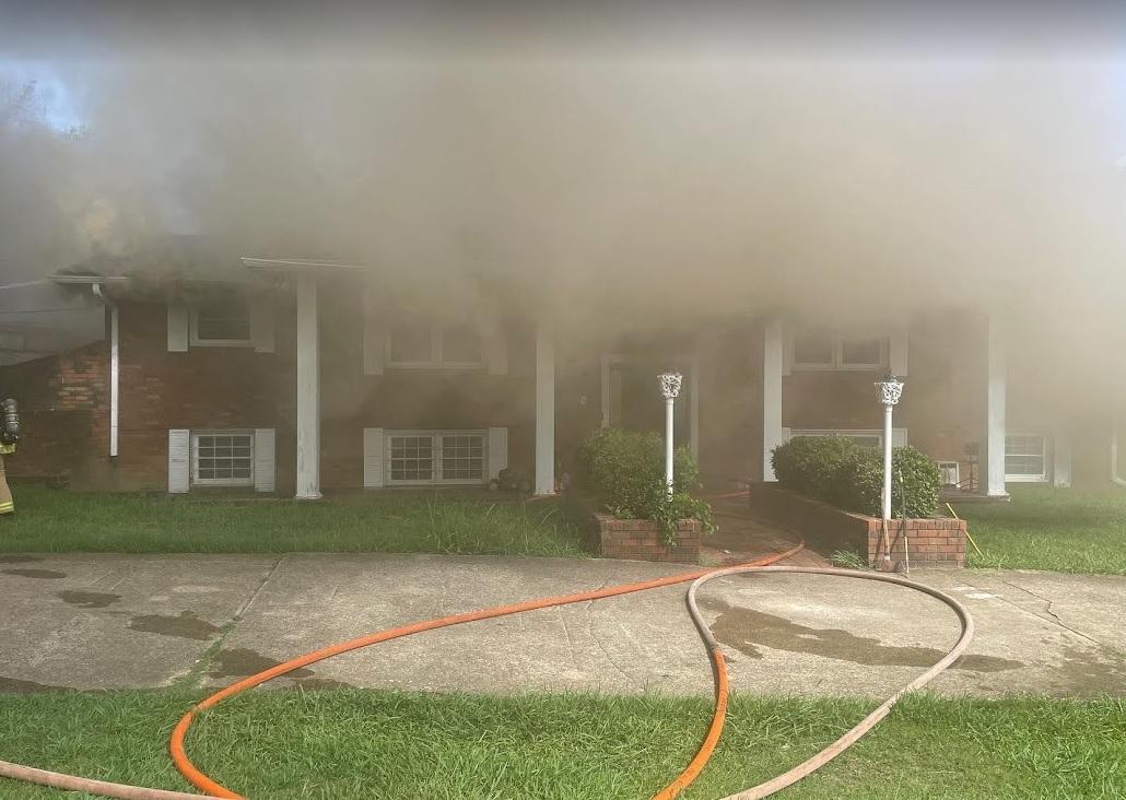 Neighbors save people trapped in burning home