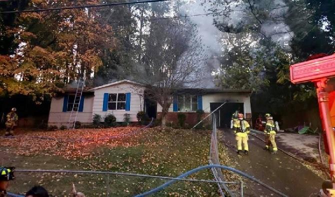 Red Cross assisting couple after fire on Noah Reid Rd