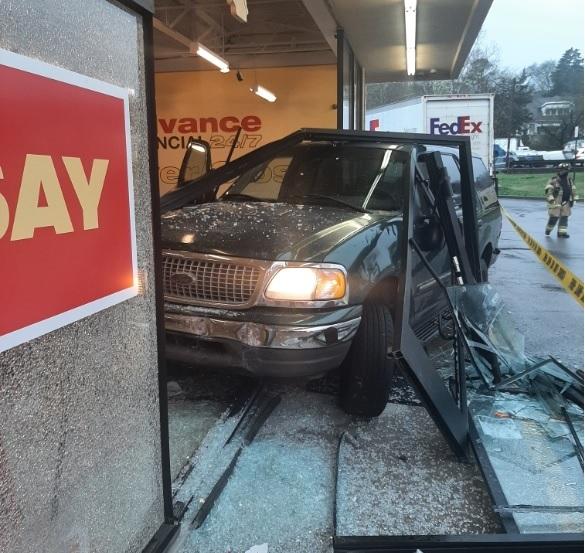 SUV crashes into business